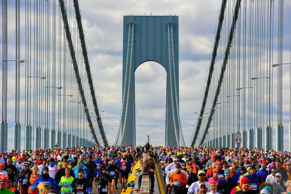 NEW YORK; NY - NOVEMBER 02:  Runners cross the Verrazano-Narrows Bridge at the start of the TCS New York City Marathon on November 2; 2014 in the Brooklyn borough of New York City.  (Photo by Alex Goodlett/Getty Images)