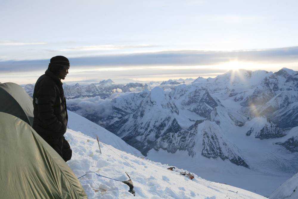 A sherpa reflecting on Mount Everest.