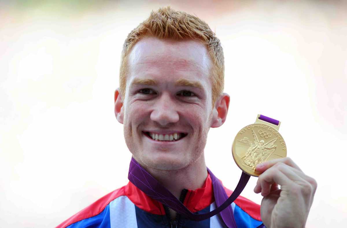 LONDON, ENGLAND - AUGUST 05:  Gold medalist Greg Rutherford of Great Britain pose on the podium for Men's Long Jump on Day 9 of the London 2012 Olympic Games at the Olympic Stadium on August 5, 2012 in London, England.  (Photo by Mike Hewitt/Getty Images)