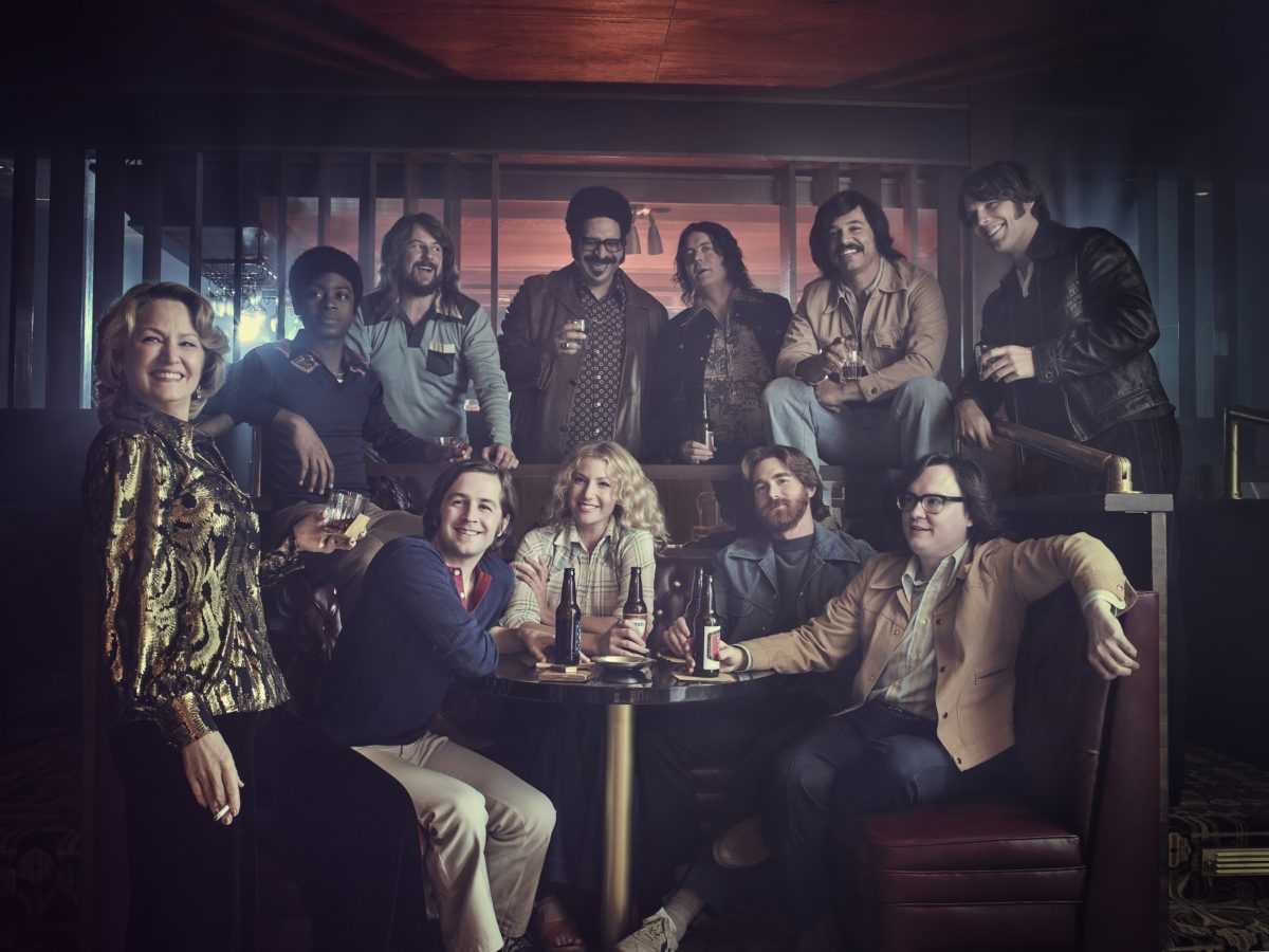 The cast of the Showtime original series I'M DYING UP HERE (Season 1, Gallery). - Photo: Patrick Ecclesine/SHOWTIME - Photo ID: IDUH_S1_PRArt2.R
Pictured: (Standing) Melissa Leo as Goldie, RJ Cyler as Adam, Stephen Guarino as Sully, Erik Griffin as Ralph, Jon Daly as Arnie, Al Madrigal as Edgar and Jake Lacy as Nick; (seated) Michael Angarano as Eddie, Ari Graynor as Cassie, Andrew Santino as Bill and Clark Duke as Ron.