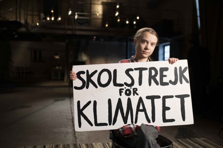 Picture Shows: Greta Thunberg with Sign close up in Stockholm