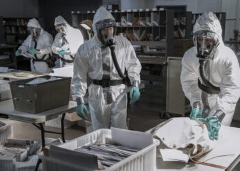 Special Agent Matthew Ryker, played by Daniel Dae Kim, inspects mail in the mailroom at 30 Rock. (National Geographic/Peter Stranks)