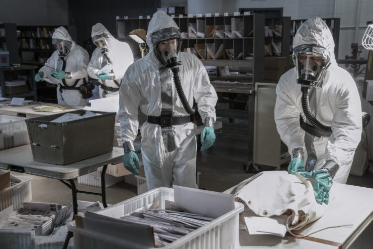 Special Agent Matthew Ryker, played by Daniel Dae Kim, inspects mail in the mailroom at 30 Rock. (National Geographic/Peter Stranks)